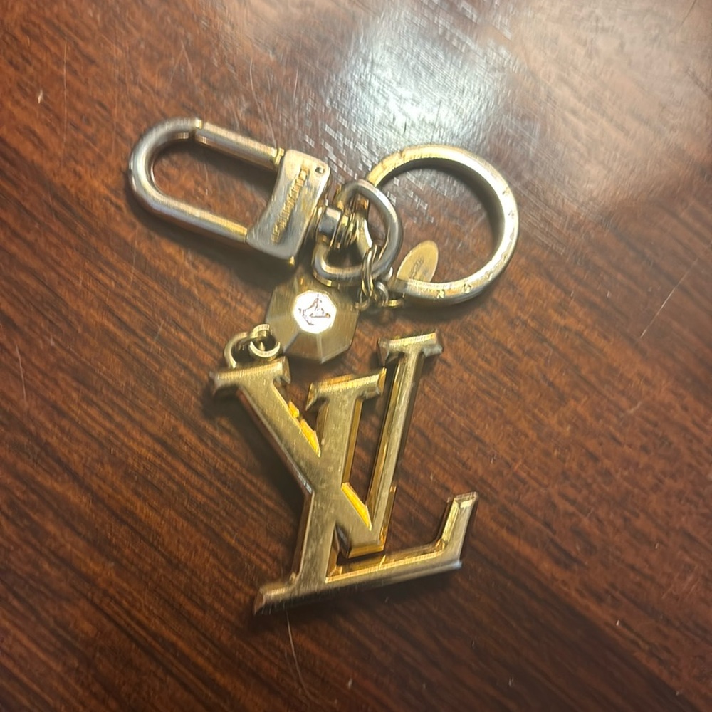 Louis Vuitton Gold Keychain with original box and gift bag.